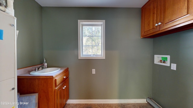 bathroom featuring baseboards and vanity