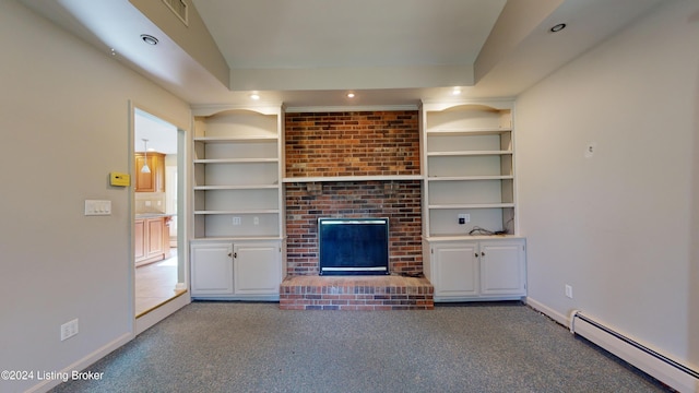 unfurnished living room featuring a baseboard radiator, carpet flooring, a fireplace, and visible vents