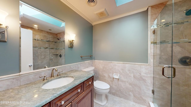 full bath with visible vents, toilet, a stall shower, ornamental molding, and vanity