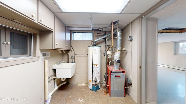 utility room featuring water heater, a heating unit, and a sink