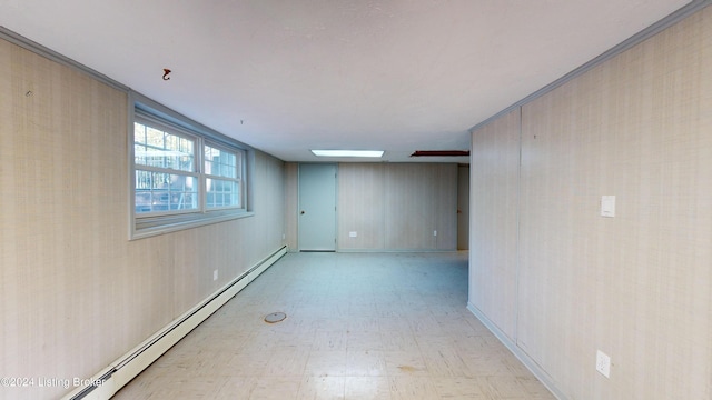 empty room with tile patterned floors and a baseboard radiator