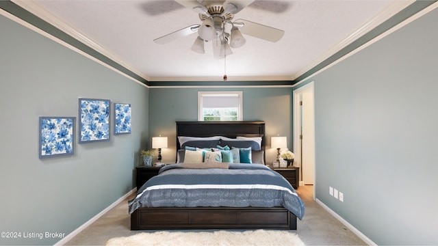 bedroom with ceiling fan, baseboards, carpet, and ornamental molding