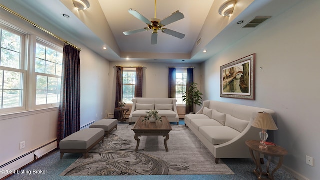 living area with recessed lighting, visible vents, baseboards, and baseboard heating