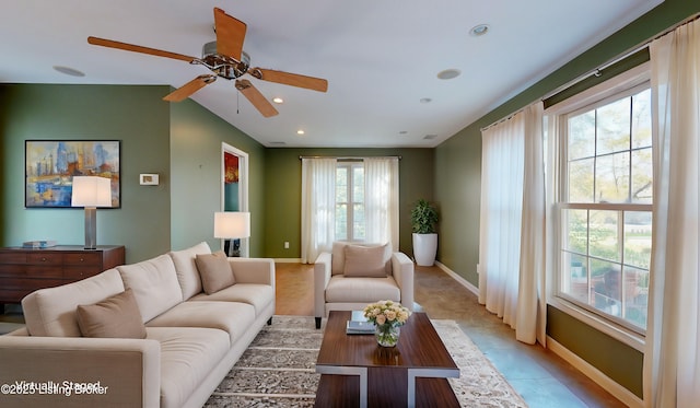 living room with light tile patterned floors, recessed lighting, and baseboards