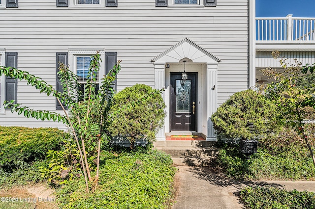 doorway to property featuring a balcony