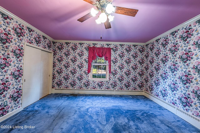 carpeted empty room with crown molding and ceiling fan