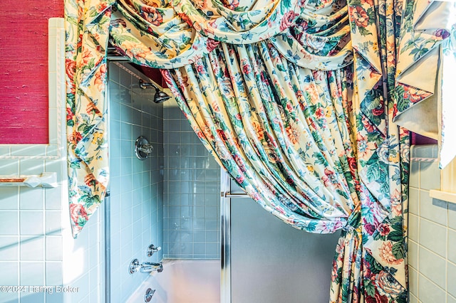 bathroom with shower / bath combo with shower curtain