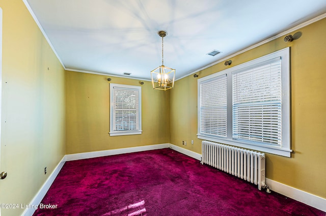 spare room with radiator, crown molding, and carpet