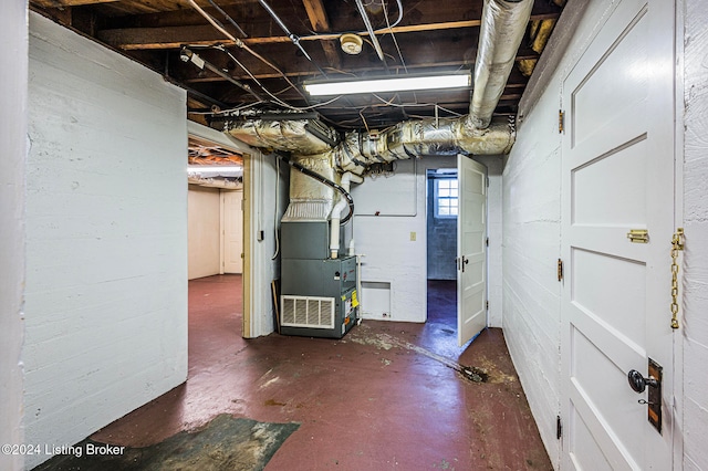 basement featuring heating unit