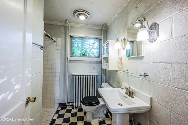 bathroom with walk in shower, radiator, toilet, ornamental molding, and sink