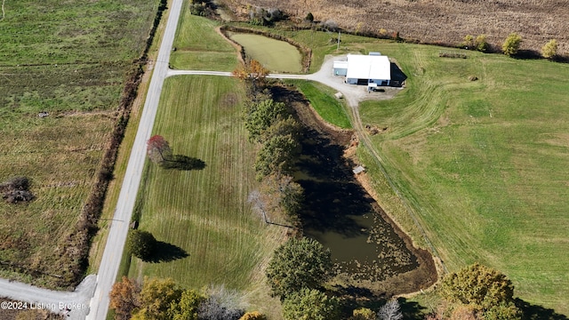 drone / aerial view with a water view and a rural view