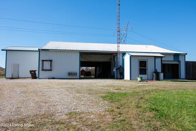 view of outbuilding featuring a lawn