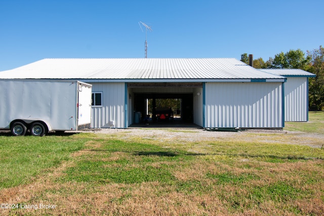 view of outdoor structure with a lawn