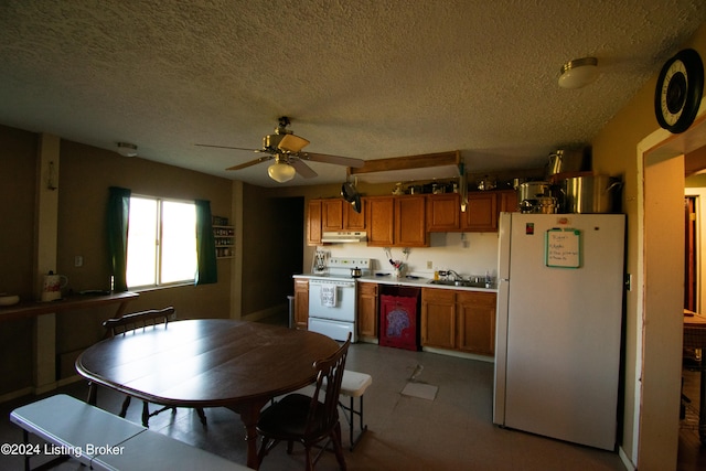 kitchen featuring white appliances, ceiling fan, a textured ceiling, and sink