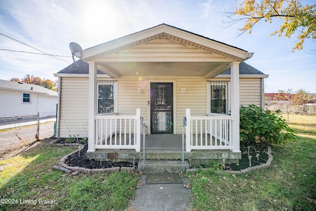 bungalow featuring a front yard and a porch