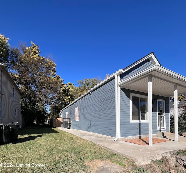 view of property exterior featuring a lawn