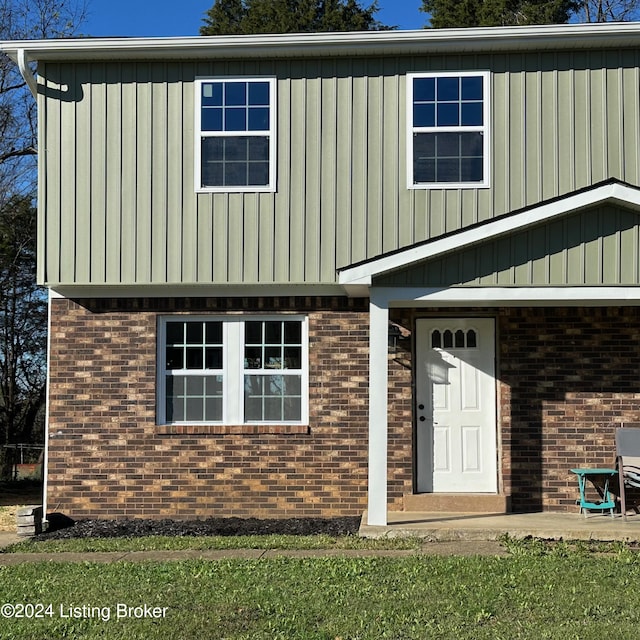 744 Brian Ct, Radcliff, KY 40160 - view of front of home featuring brick siding and board and batten siding