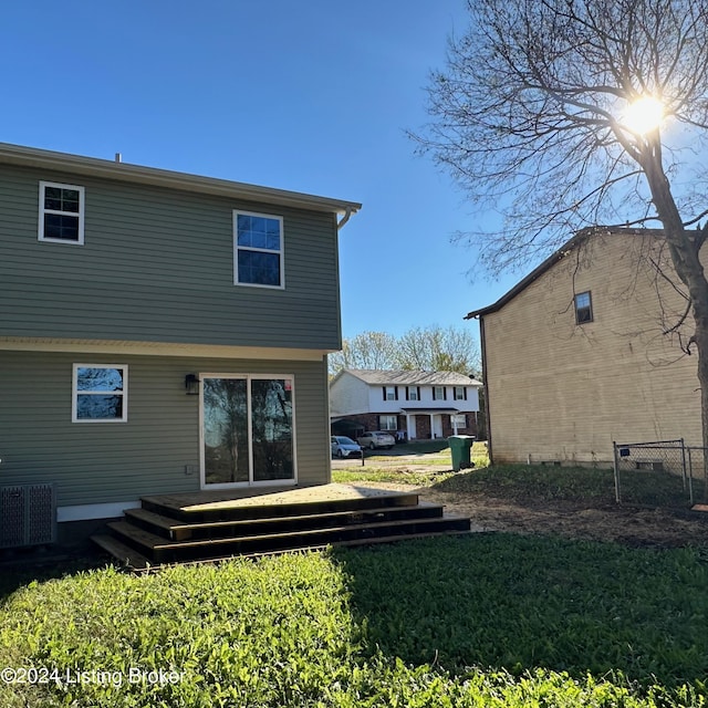 744 Brian Ct, Radcliff, KY 40160 - back of property with a wooden deck and central AC unit