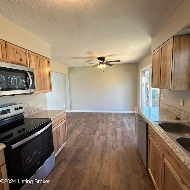 744 Brian Ct, Radcliff, KY 40160 - kitchen featuring appliances with stainless steel finishes, ceiling fan, dark wood-type flooring, light countertops, and a sink