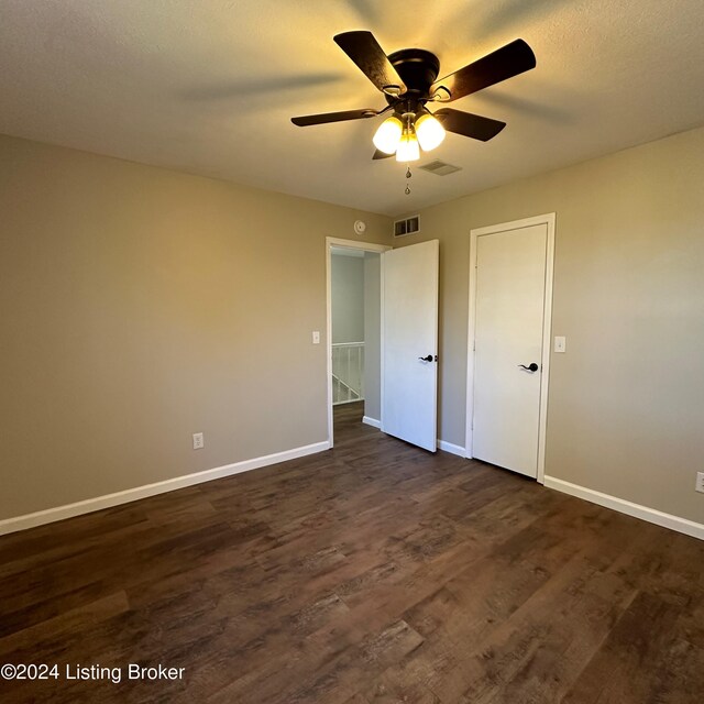 744 Brian Ct, Radcliff, KY 40160 - unfurnished bedroom featuring baseboards, dark wood-type flooring, and ceiling fan