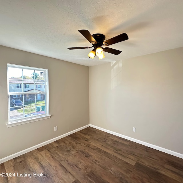 744 Brian Ct, Radcliff, KY 40160 - empty room with dark wood-style flooring, ceiling fan, baseboards, and a textured ceiling