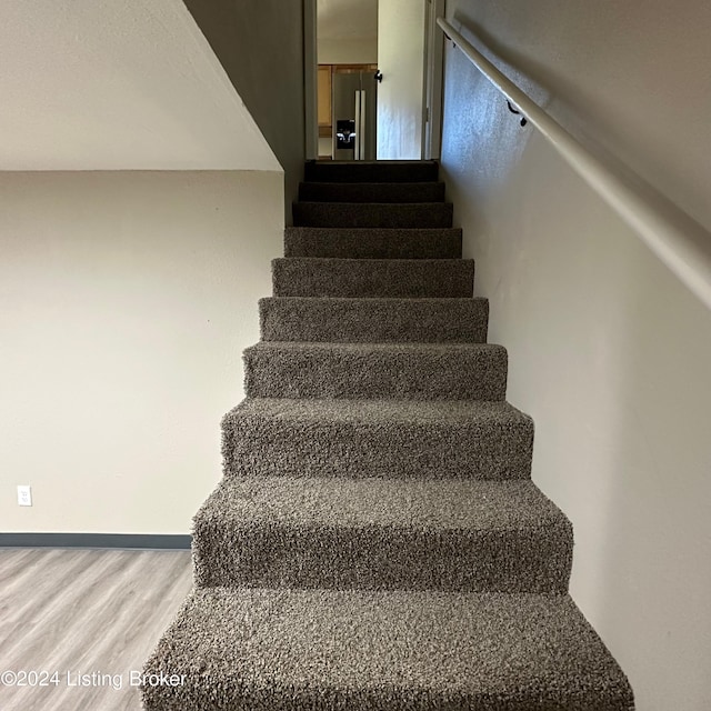744 Brian Ct, Radcliff, KY 40160 - staircase featuring wood finished floors