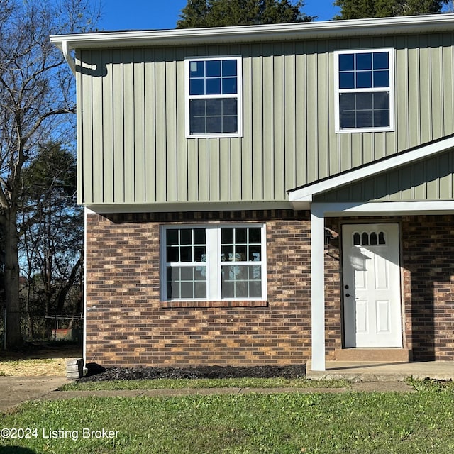 744 Brian Ct, Radcliff, KY 40160 - view of front facade with board and batten siding and brick siding