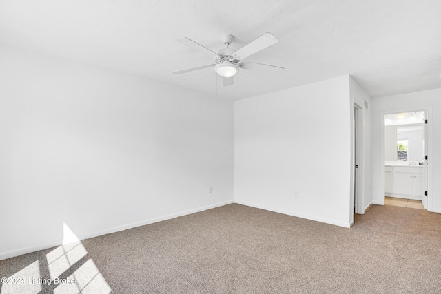 carpeted empty room with ceiling fan