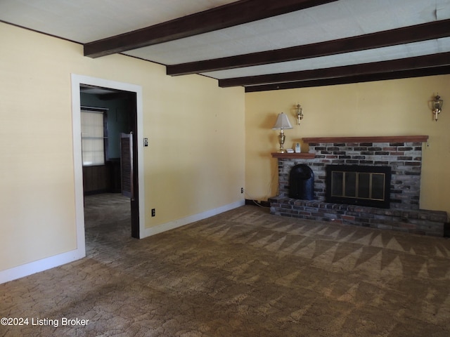 unfurnished living room with a fireplace, beam ceiling, and dark carpet