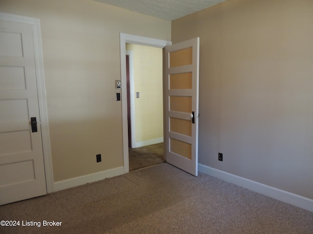 unfurnished bedroom featuring carpet