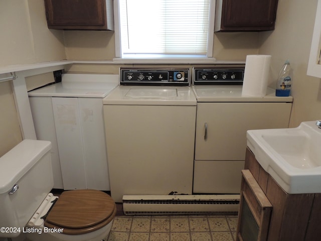 laundry room with washer and clothes dryer and sink