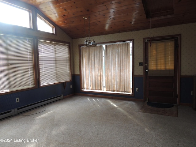 carpeted empty room featuring baseboard heating, wood ceiling, vaulted ceiling, and a notable chandelier