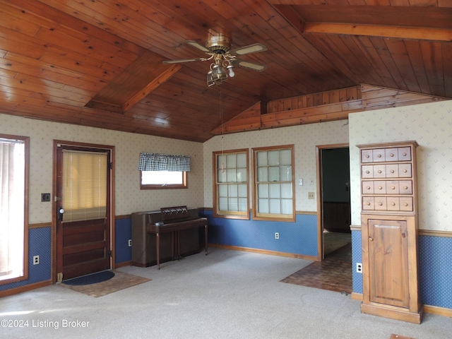 unfurnished living room with light carpet, ceiling fan, and wood ceiling