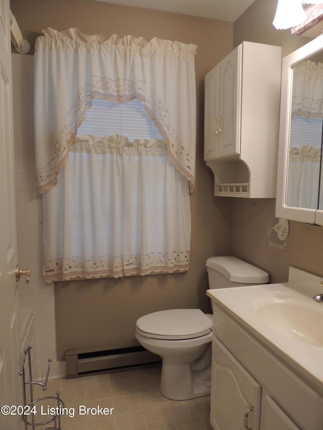 bathroom featuring vanity, toilet, and a baseboard heating unit