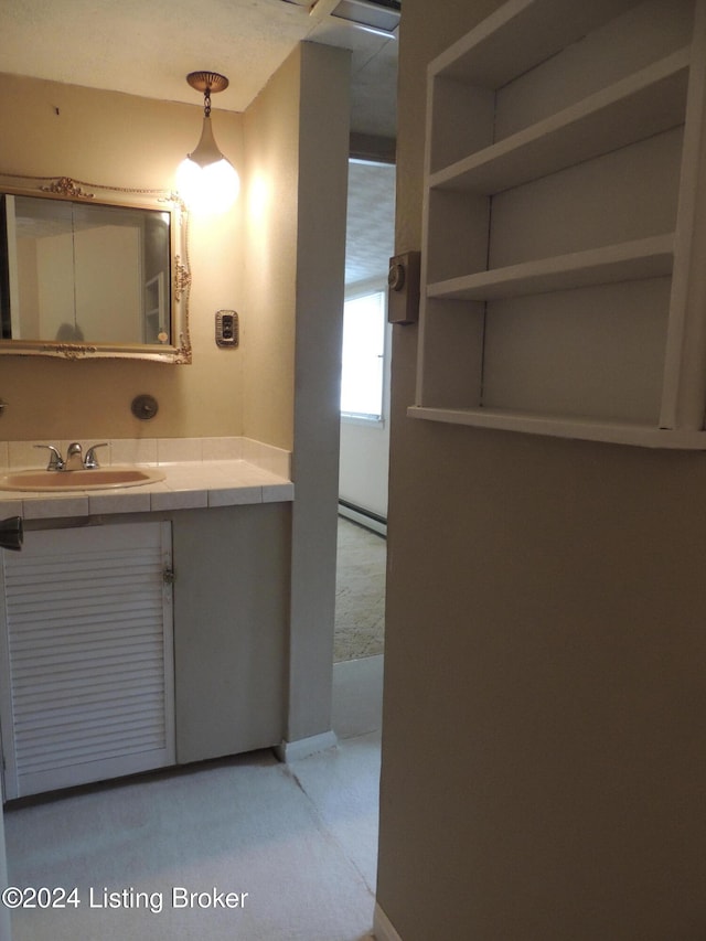 bathroom featuring vanity and a baseboard radiator