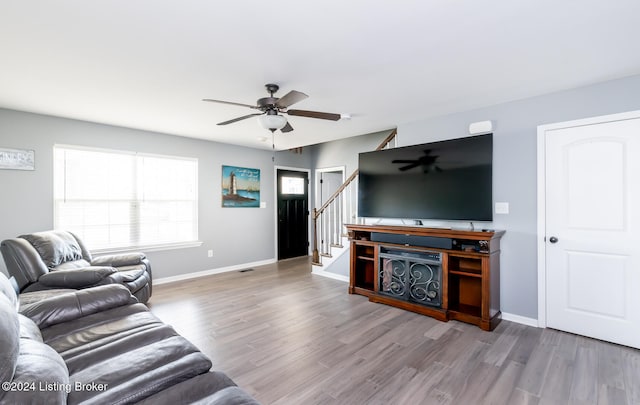 living room with ceiling fan and wood-type flooring