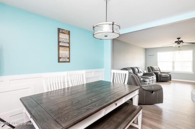 dining area featuring light hardwood / wood-style flooring and ceiling fan