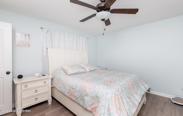 bedroom featuring dark wood-type flooring and ceiling fan