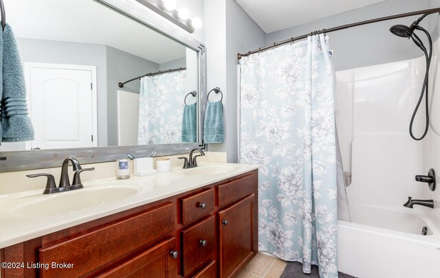 bathroom featuring vanity, shower / bath combo, and tile patterned flooring