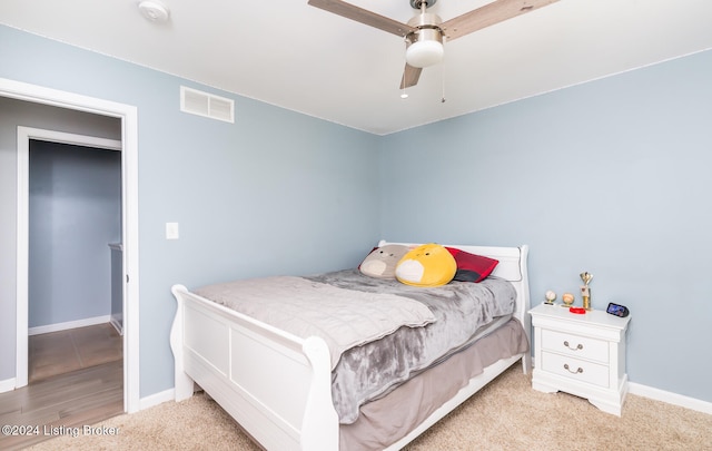 bedroom featuring light hardwood / wood-style floors and ceiling fan