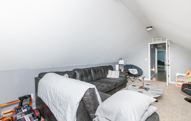 living room with lofted ceiling and carpet floors