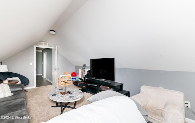 carpeted living room with vaulted ceiling