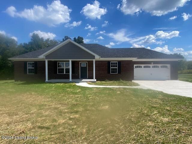 ranch-style home with a garage, a front lawn, and a porch