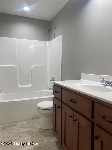 full bathroom with vanity, toilet, and washtub / shower combination