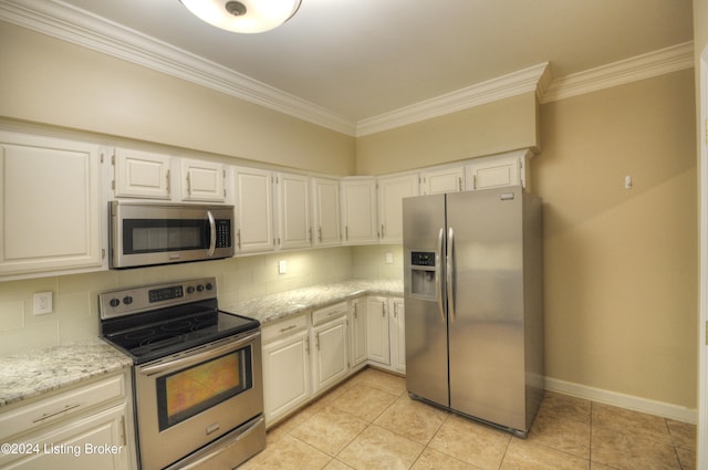 kitchen featuring backsplash, white cabinetry, light stone countertops, and appliances with stainless steel finishes