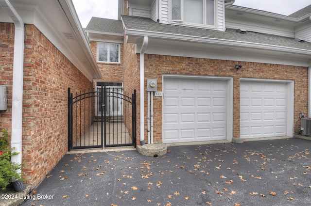 view of side of home featuring a garage