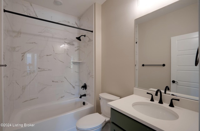 full bathroom featuring tiled shower / bath combo, toilet, and vanity