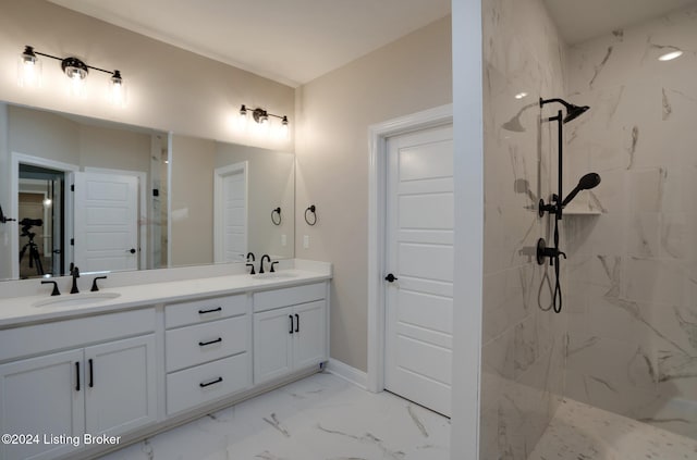 bathroom featuring vanity and a tile shower