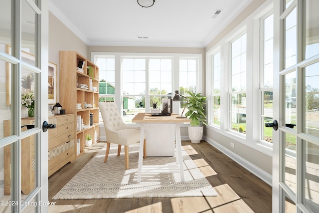 sunroom featuring french doors and a healthy amount of sunlight