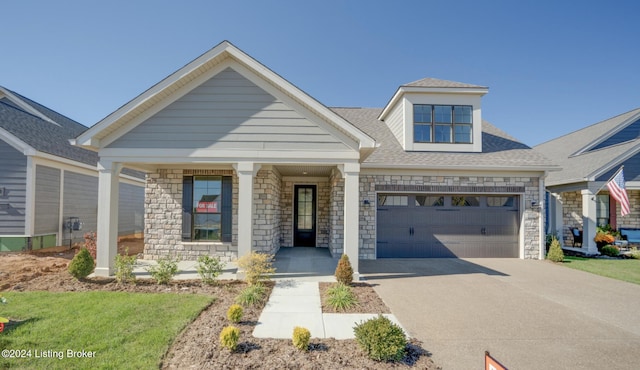 17105 Farrier Dr, Louisville, KY 40245 - craftsman inspired home featuring a porch, an attached garage, driveway, and stone siding
